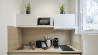 Cuisine ou kitchenette dans l'établissement Manu Chalons