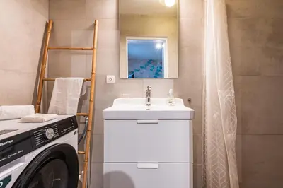 Salle de bains dans l'établissement suite Tirelire, centre et paisible