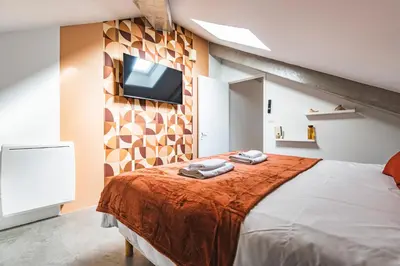 Un ou plusieurs lits dans un hébergement de l'établissement MM Suites City House Cathedrale