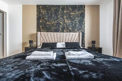 Un ou plusieurs lits dans un hébergement de l'établissement MM Suites City House Cathedrale
