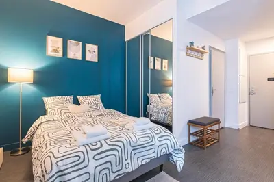 Un ou plusieurs lits dans un hébergement de l'établissement Immi Immobilier - Studio Moderne & Équipé