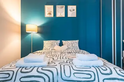 Un ou plusieurs lits dans un hébergement de l'établissement Immi Immobilier - Studio Moderne & Équipé