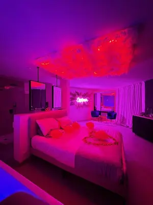 Un ou plusieurs lits dans un hébergement de l'établissement Cosy Love Room