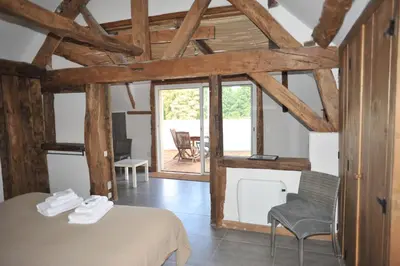 Un ou plusieurs lits dans un hébergement de l'établissement La Bergerie Du Château De Pommeuse