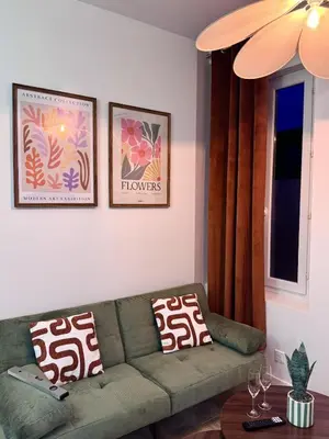 Coin salon dans l'établissement T2 Cosy - Proche centre - Stationnement gratuit