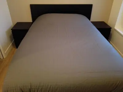 Un ou plusieurs lits dans un hébergement de l'établissement Apartment T2 Helle Stadtzentrum Voltaire Zimmer Hof by Interhome