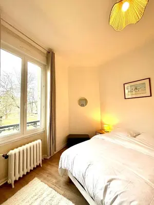 Un ou plusieurs lits dans un hébergement de l'établissement Elégant appartement au coeur de Reims