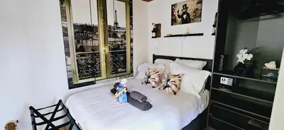 Un ou plusieurs lits dans un hébergement de l'établissement La Chambre de Ratatouille proche Disney