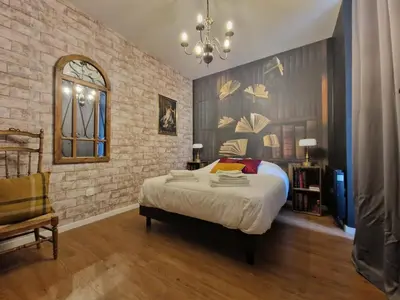 Un ou plusieurs lits dans un hébergement de l'établissement Appartement 4 pers - déco magique immersive - centre Reims