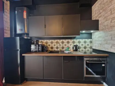 Cuisine ou kitchenette dans l'établissement Appartement 4 pers - déco magique immersive - centre Reims