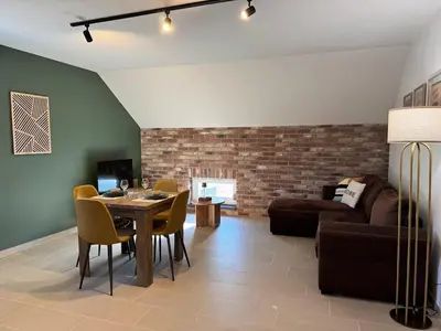Coin salon dans l'établissement Appartement à Ohain