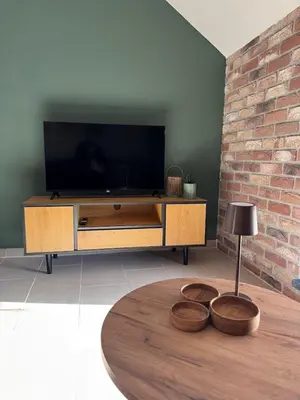 Télévision ou salle de divertissement dans l'établissement Appartement à Ohain