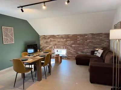 Coin salon dans l'établissement Appartement à Ohain