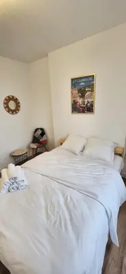 Un ou plusieurs lits dans un hébergement de l'établissement Magnifique Duplex Avec Terrasse, Proche De Av Champagne