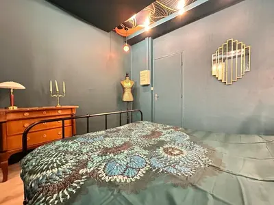Un ou plusieurs lits dans un hébergement de l'établissement Gatsby appartement confortable jacuzzi & terrasse
