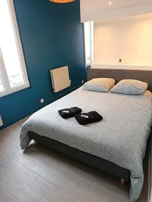 Un ou plusieurs lits dans un hébergement de l'établissement Studio des Capucins 1