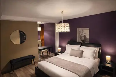 Un ou plusieurs lits dans un hébergement de l'établissement Le Flaubert Hôtel