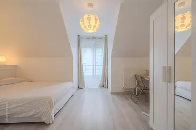 Un ou plusieurs lits dans un hébergement de l'établissement Urban Cozy Nest Paris 25 min - Disney 20min