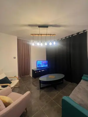 Télévision ou salle de divertissement dans l'établissement Champagne