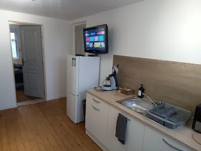Cuisine ou kitchenette dans l'établissement Le GM 2, proche commerces et gare