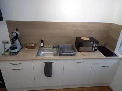 Cuisine ou kitchenette dans l'établissement Le GM 2, proche commerces et gare