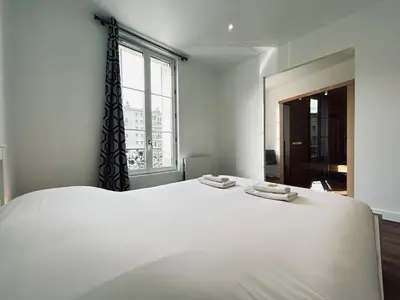 Un ou plusieurs lits dans un hébergement de l'établissement 2 Vasnier F2 avec sauna proche caves de champagne