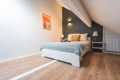 Un ou plusieurs lits dans un hébergement de l'établissement Loft des Moissons - central and double parking