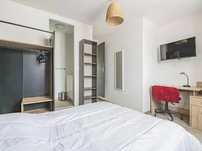 Un ou plusieurs lits dans un hébergement de l'établissement Somptueux Appartement au cœur de Reims - FR-1-870-5