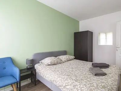 Un ou plusieurs lits dans un hébergement de l'établissement Appartement Lumineux avec WiFi au Cœur de Reims - FR-1-870-25