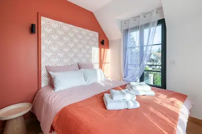 Un ou plusieurs lits dans un hébergement de l'établissement Le Jardin de Marie - Disney 30 min - Clim & Wifi
