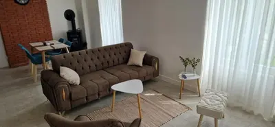Coin salon dans l'établissement Deux appartements proche Disneyland