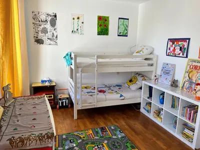 Un ou plusieurs lits dans un hébergement de l'établissement Maison avec jardin au centre de Chateau-Thierry