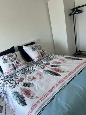 Un ou plusieurs lits dans un hébergement de l'établissement Appartement calme et cosy tout équipé