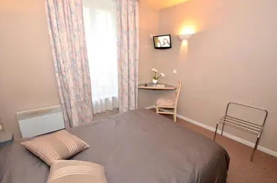 Un ou plusieurs lits dans un hébergement de l'établissement Hôtel de l'Ours