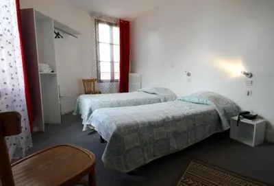 Un ou plusieurs lits dans un hébergement de l'établissement Hôtel de l'Ours