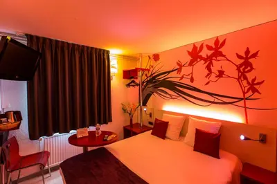 Un ou plusieurs lits dans un hébergement de l'établissement Hôtel Inn Design & Restaurant Sedan