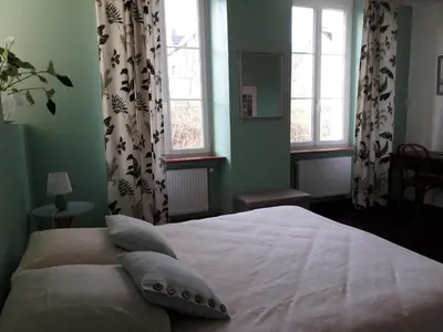 Un ou plusieurs lits dans un hébergement de l'établissement AMBIANCES chambres d 'hôtes