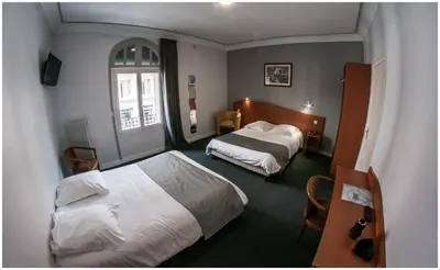 Un ou plusieurs lits dans un hébergement de l'établissement Hôtel Gambetta