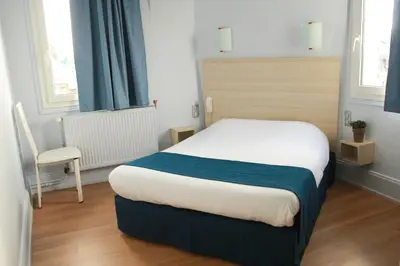 Un ou plusieurs lits dans un hébergement de l'établissement Hôtel De La Cathédrale