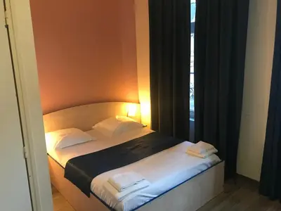 Un ou plusieurs lits dans un hébergement de l'établissement Hotel César Centre-ville Gare Charleville-Mézières