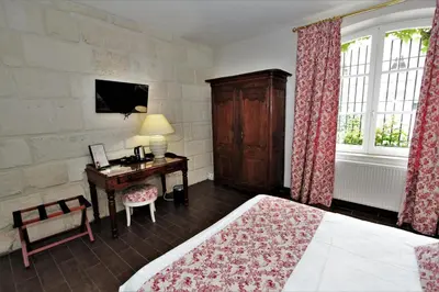 Un ou plusieurs lits dans un hébergement de l'établissement Hôtel Le Régent