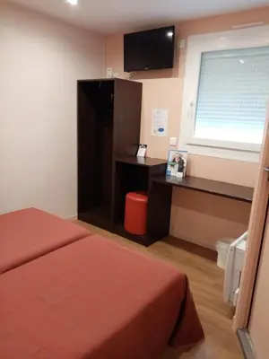 Un ou plusieurs lits dans un hébergement de l'établissement Brit Hotel St-Quentin/Nord