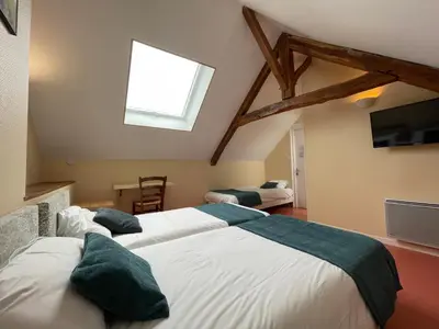 Un ou plusieurs lits dans un hébergement de l'établissement Auberge De L'Omois