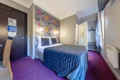 Un ou plusieurs lits dans un hébergement de l'établissement Hôtel Azur Reims Centre