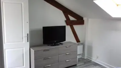 Télévision ou salle de divertissement dans l'établissement Gîte de la Py