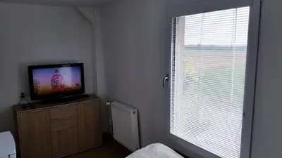Télévision ou salle de divertissement dans l'établissement Country House Reem