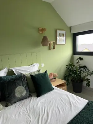 Un ou plusieurs lits dans un hébergement de l'établissement Aux Chambres d'à Coté