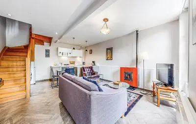 Coin salon dans l'établissement Apt B