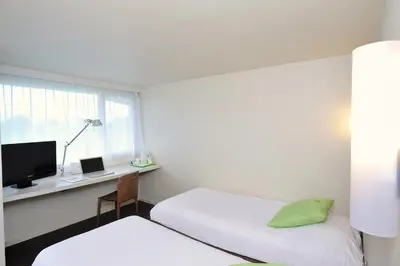 Un ou plusieurs lits dans un hébergement de l'établissement Campanile Reims Est - Taissy