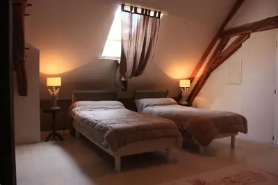 Un ou plusieurs lits dans un hébergement de l'établissement Gîte le St Vincent